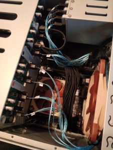 A look inside a small NAS server, showing the cable management and components in place